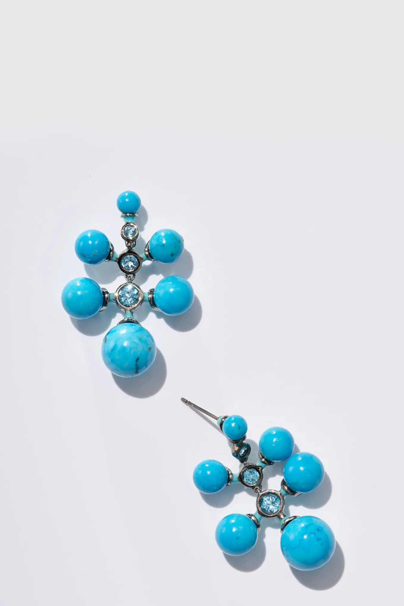 radiant_earrings__blue_ho_0.webp Radiant Earrings - Blue Howlite